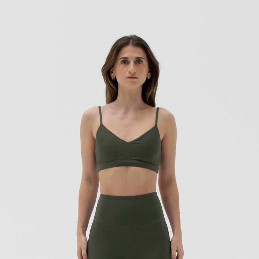 Green v-neck sports bra made from recycled plastic bottles