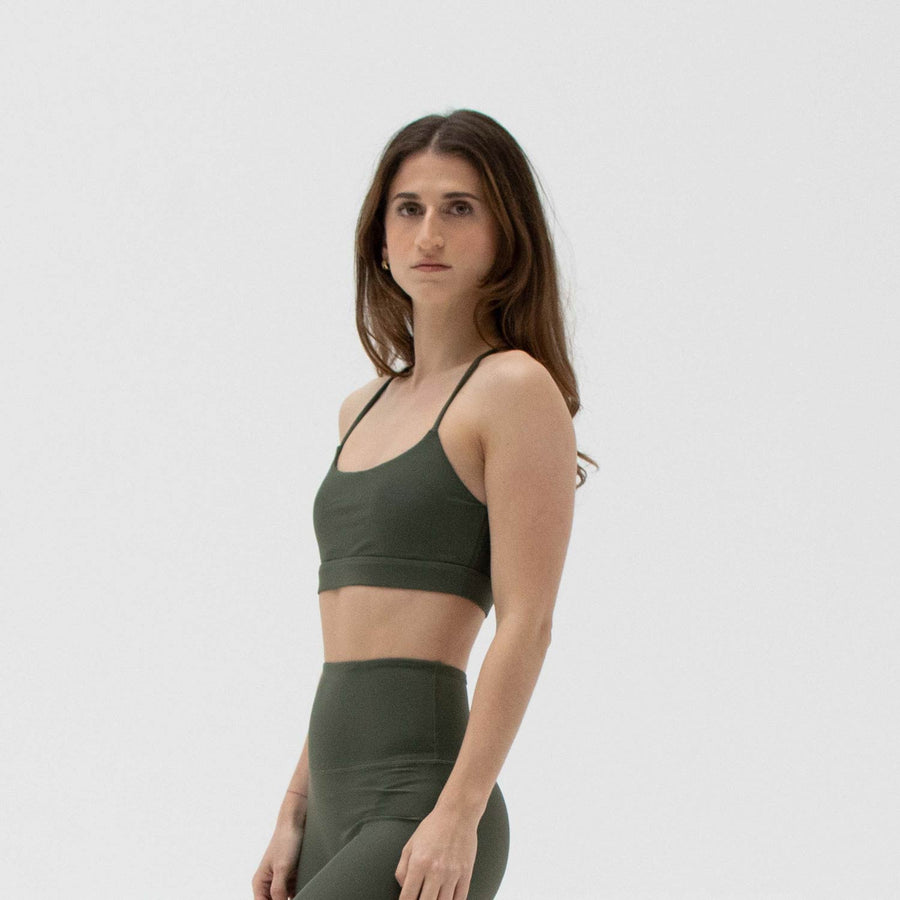 Green scoop neck sports bra made from recycled plastic bottles