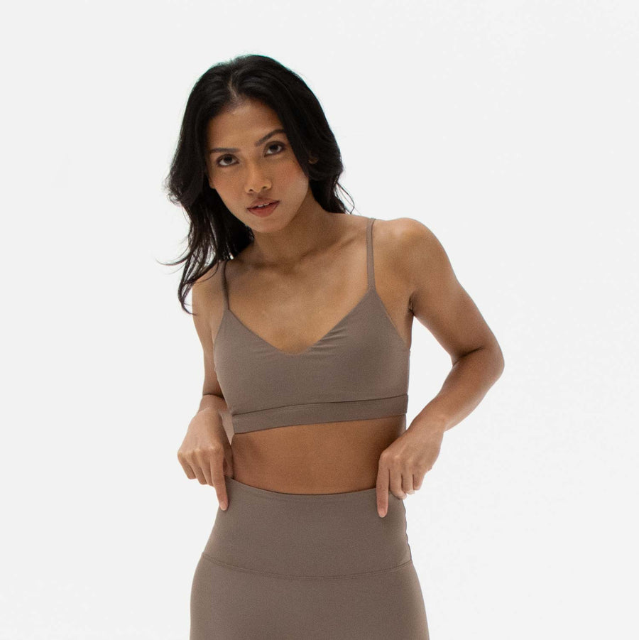 Brown v-neck sports bra made from recycled plastic bottles